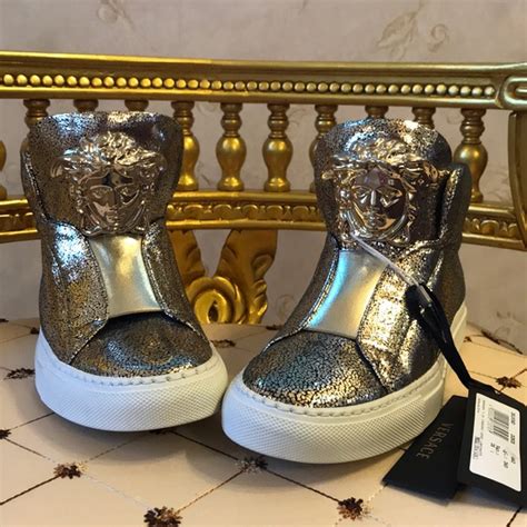 silver and gold Versace shoes